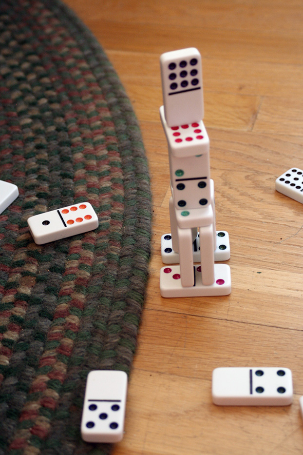a tower of dominos about to fall