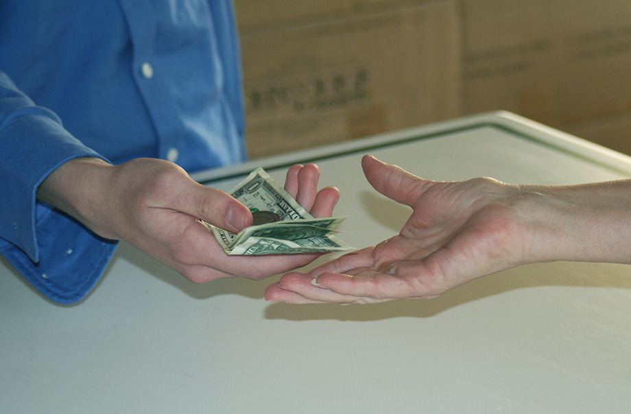 a cashier hands back change