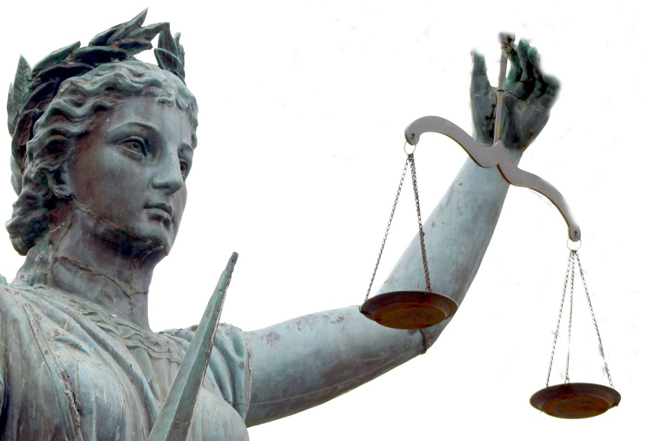 statue holds out a scale and a sword