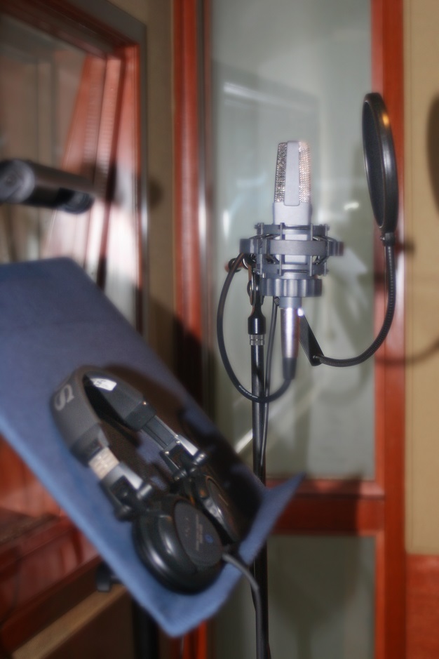 a microphone and headphones in a recording studio